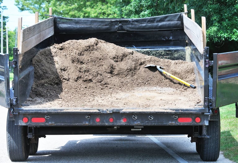 Dump trailer hauling materials for construction and landscaping